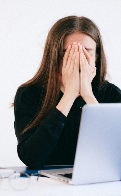 woman-with-hands-on-her-face-in-front-of-a-laptop-4226215 (1)